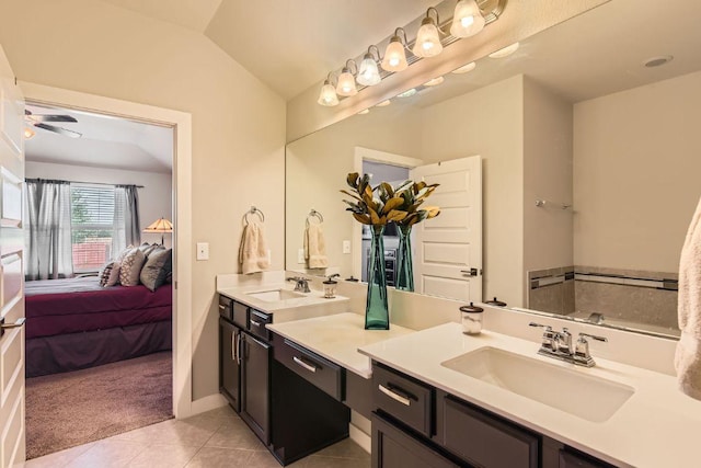 full bath featuring vanity, lofted ceiling, ensuite bathroom, and tile patterned floors