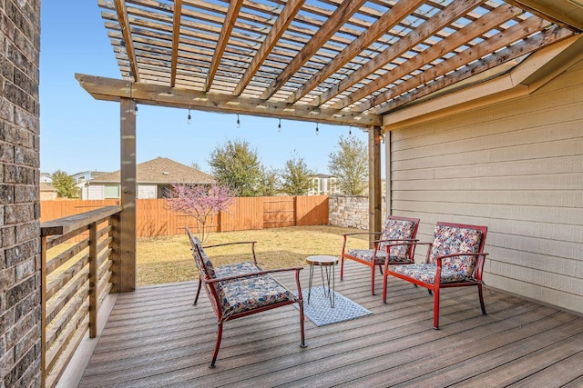 deck with a fenced backyard, a pergola, and a lawn