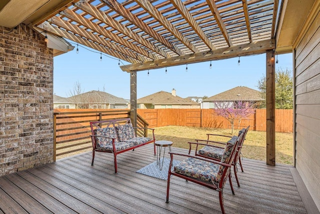 wooden terrace featuring a yard, an outdoor living space, a pergola, and a fenced backyard