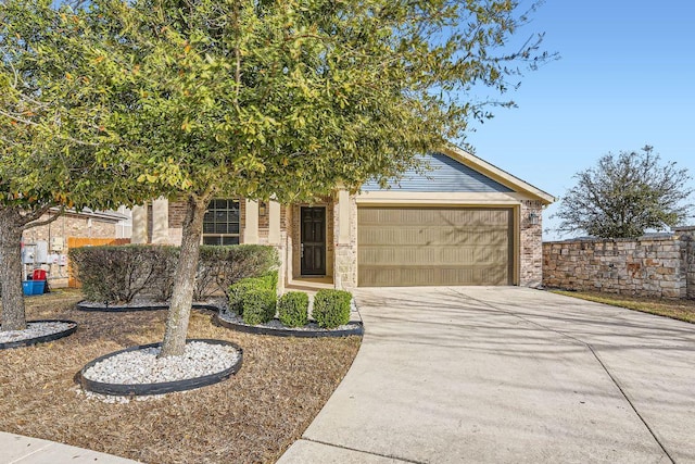 view of front of home featuring driveway and a garage