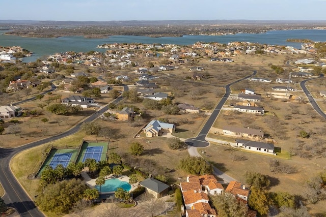 3206 Douglas Dr, Horseshoe Bay, TX 78657 - aerial view of property and surrounding area featuring a nearby body of water, a pool, and nearby suburban area