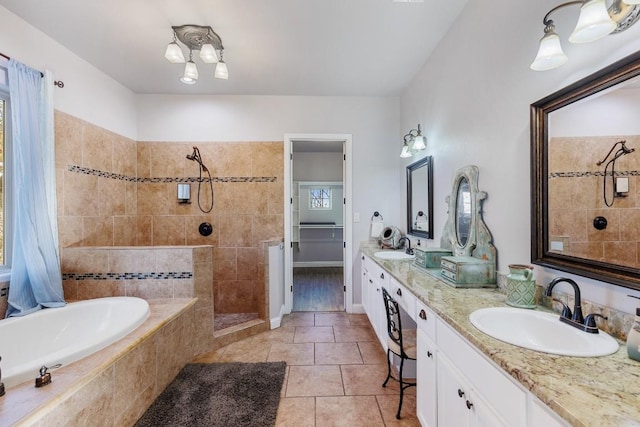 bathroom featuring tile patterned floors, a sink, tiled bath, double vanity, and tiled shower