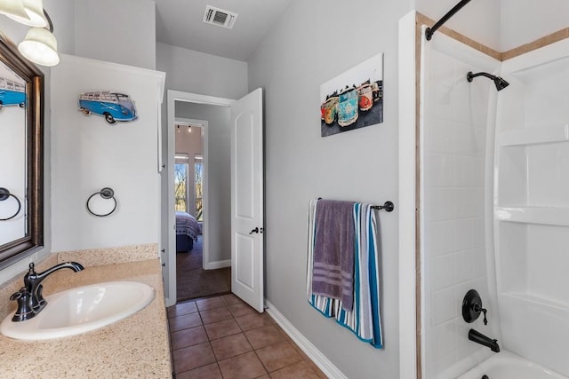 ensuite bathroom featuring vanity, visible vents,  shower combination, ensuite bath, and tile patterned flooring