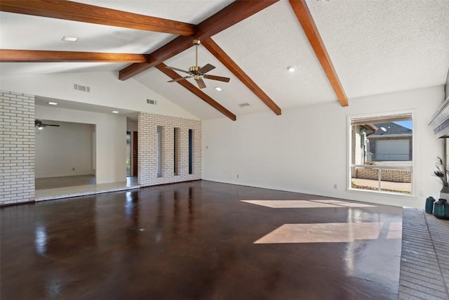 unfurnished living room with beam ceiling, a ceiling fan, visible vents, and a textured ceiling