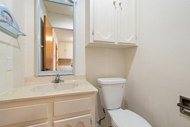 half bath with toilet and vanity