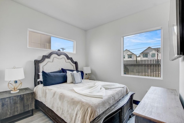 bedroom with wood finished floors