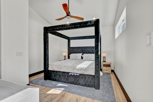 bedroom featuring a ceiling fan, wood finished floors, and baseboards