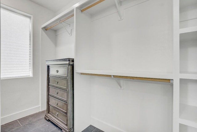 spacious closet featuring tile patterned floors