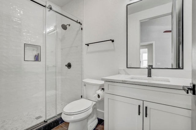 full bathroom with tile patterned floors, vanity, toilet, and a shower stall