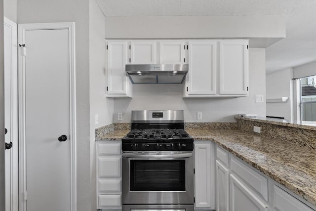 kitchen featuring white cabinetry, light stone countertops, stainless steel gas stove, and under cabinet range hood