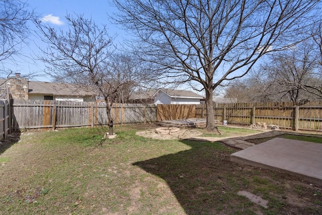 view of yard with a patio and a fenced backyard