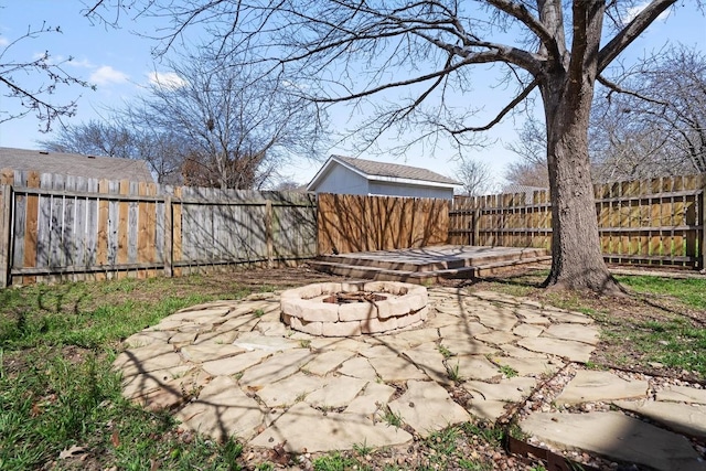 view of patio / terrace featuring a fenced backyard and an outdoor fire pit