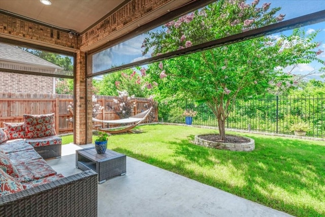 view of patio featuring an outdoor living space and a fenced backyard