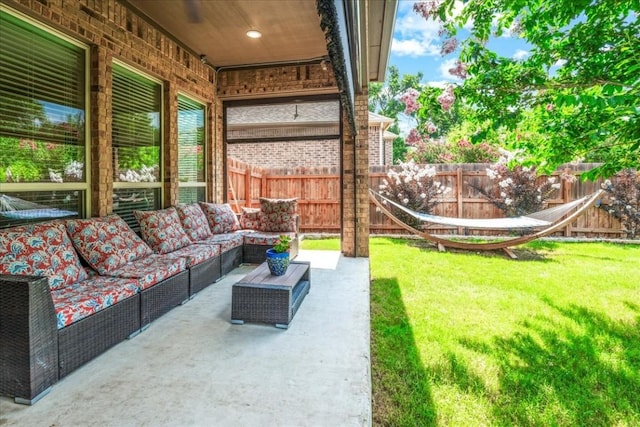 view of patio with an outdoor living space and a fenced backyard