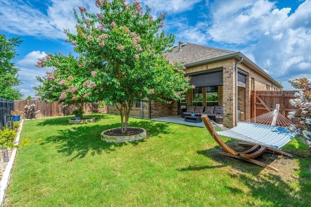 view of yard featuring a patio and a fenced backyard