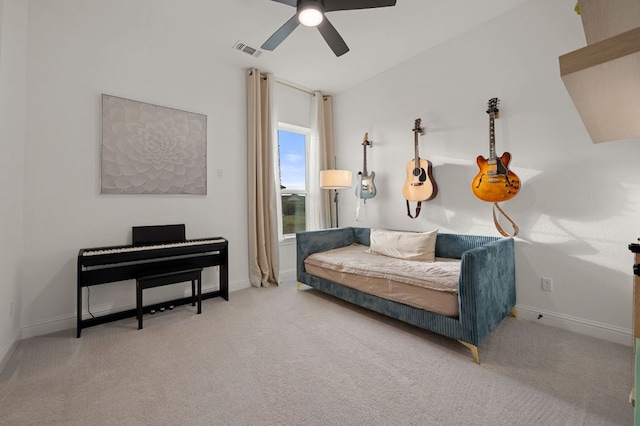 living area with baseboards, carpet, visible vents, and ceiling fan