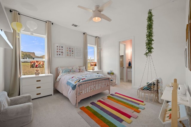 bedroom featuring visible vents, light carpet, and ceiling fan