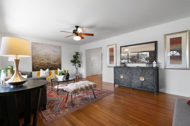 living room featuring ceiling fan and wood finished floors