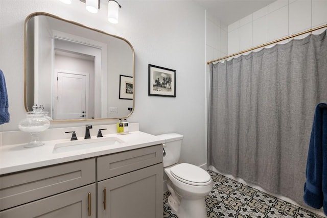 bathroom featuring vanity, tile patterned floors, curtained shower, and toilet