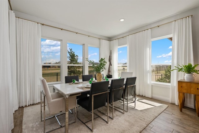 dining space featuring recessed lighting and light wood-type flooring