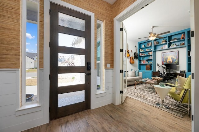 entryway with a ceiling fan and wood finished floors