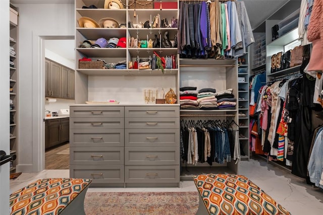 spacious closet with marble finish floor