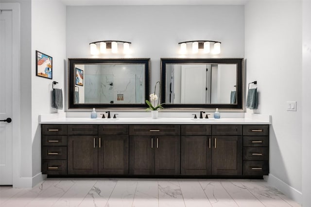 full bath featuring a marble finish shower, a sink, marble finish floor, and double vanity