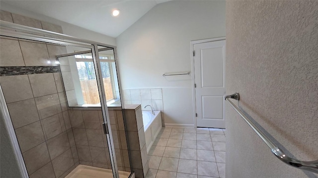 full bath with tile patterned floors, a garden tub, a shower stall, and vaulted ceiling