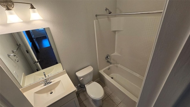 bathroom featuring tile patterned floors, vanity, toilet, and washtub / shower combination