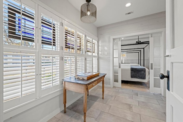 corridor with light tile patterned floors, recessed lighting, and visible vents