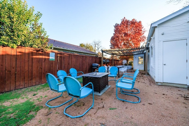 view of yard featuring a patio area, a fire pit, a fenced backyard, and a pergola