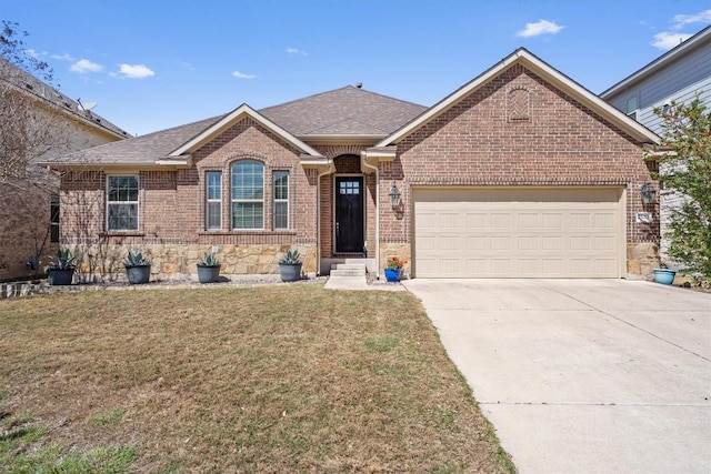 ranch-style house with a front yard, driveway, roof with shingles, an attached garage, and brick siding