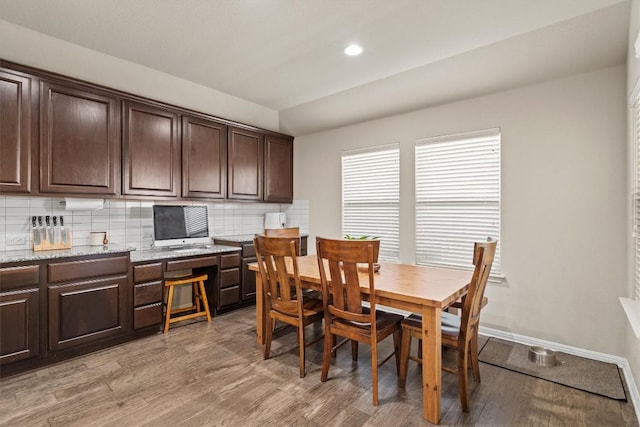 dining area featuring recessed lighting, baseboards, light wood-style flooring, and built in study area