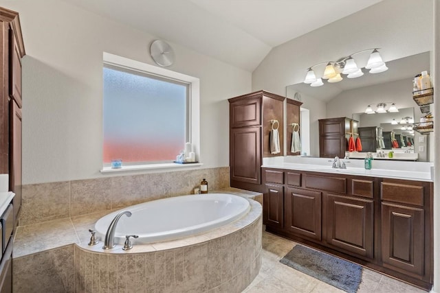 full bathroom with a bath, vanity, and vaulted ceiling