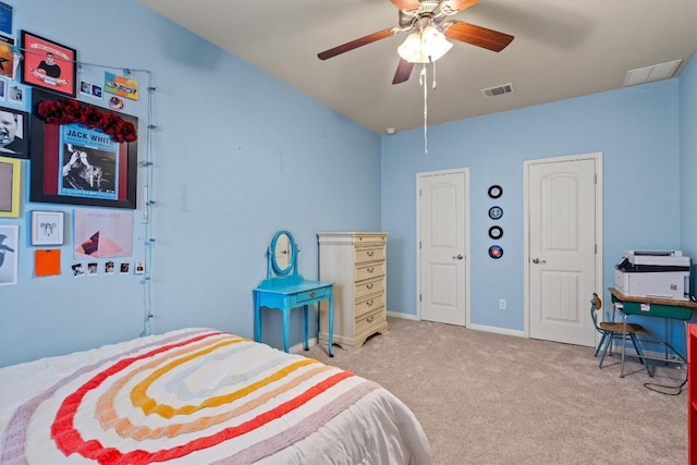 bedroom with a ceiling fan, baseboards, visible vents, and carpet floors