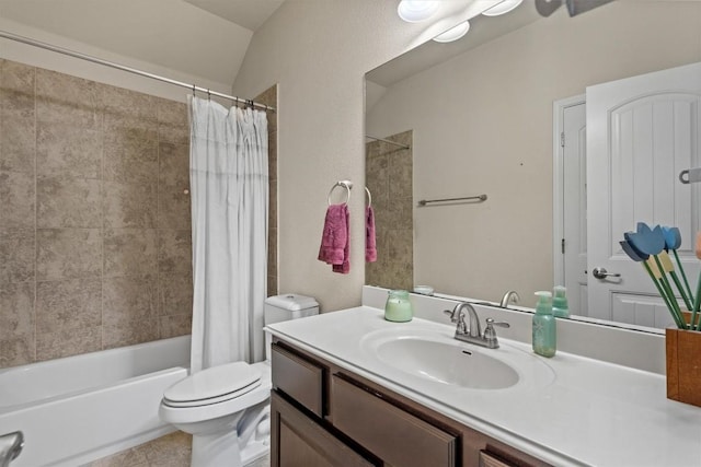 bathroom with vanity, shower / bath combination with curtain, toilet, and vaulted ceiling