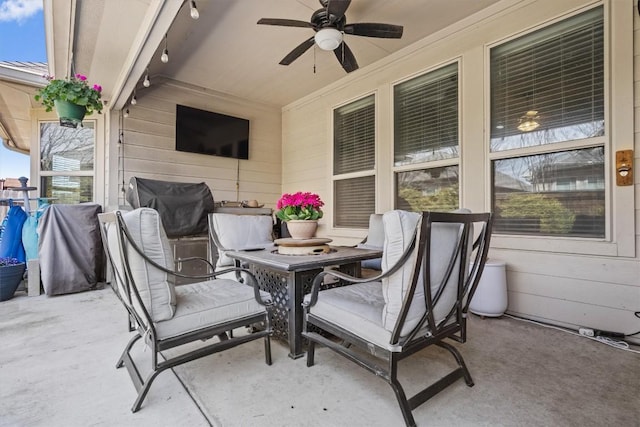 view of patio / terrace with a ceiling fan and a grill