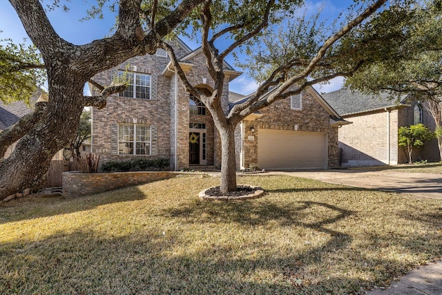 traditional home featuring brick siding, concrete driveway, a front lawn, and an attached garage