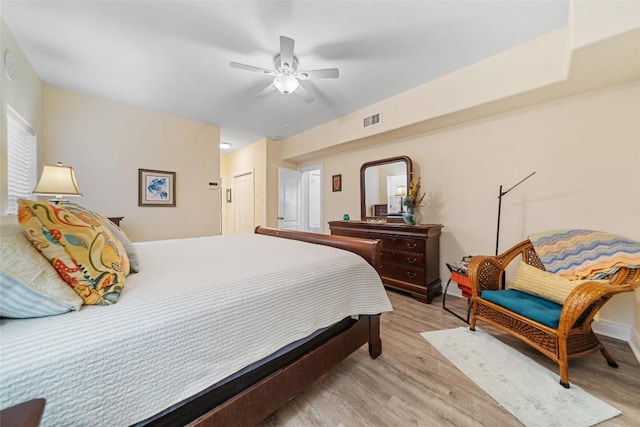 bedroom with visible vents, light wood-type flooring, and ceiling fan