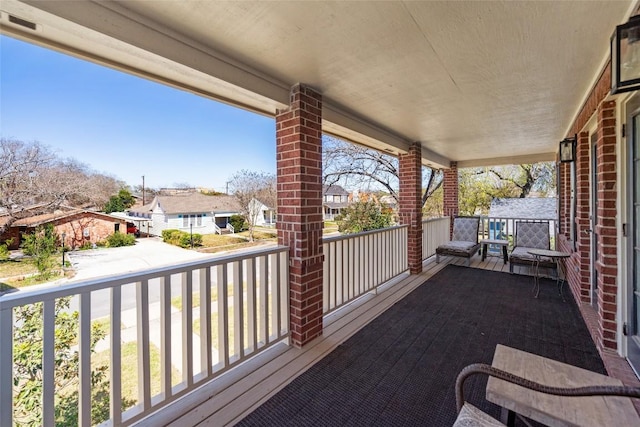 balcony featuring a residential view