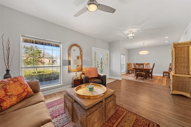 living room with ceiling fan, baseboards, wood finished floors, and recessed lighting