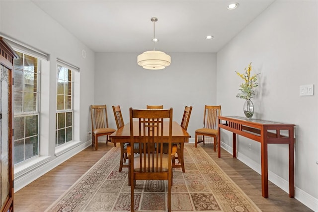 dining area with recessed lighting, baseboards, and light wood-style flooring