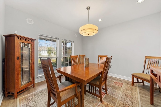 dining space with recessed lighting, baseboards, and light wood-style floors