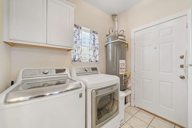 laundry room with gas water heater, cabinet space, separate washer and dryer, and light tile patterned flooring