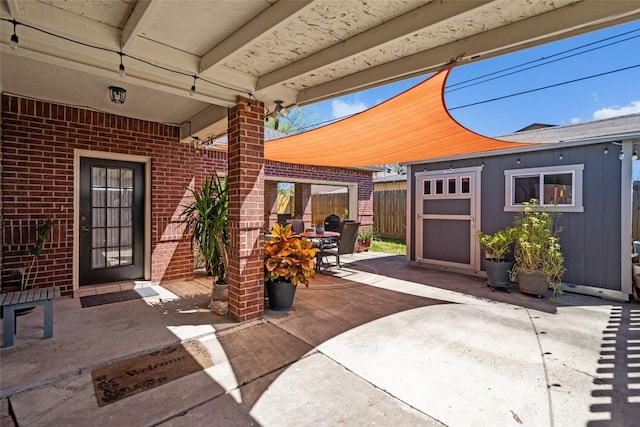 view of patio with outdoor dining space and fence