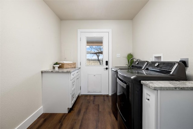 917 County Road 664, Devine, TX 78016 - washroom with separate washer and dryer and dark wood finished floors