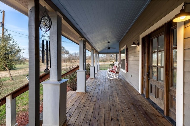 917 County Road 664, Devine, TX 78016 - wooden porch with a ceiling fan