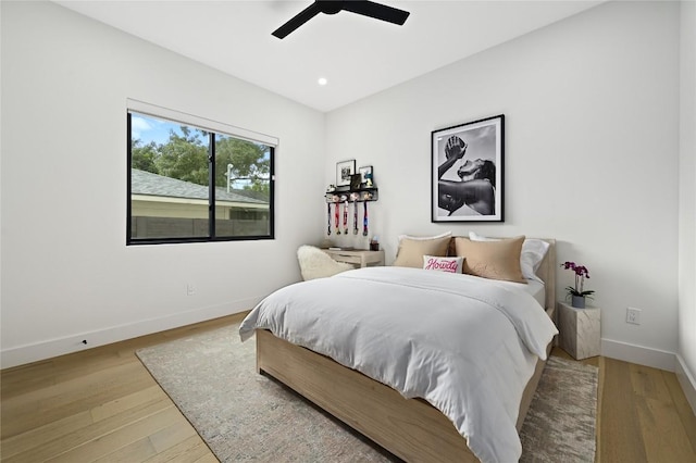 bedroom with recessed lighting, ceiling fan, baseboards, and wood finished floors