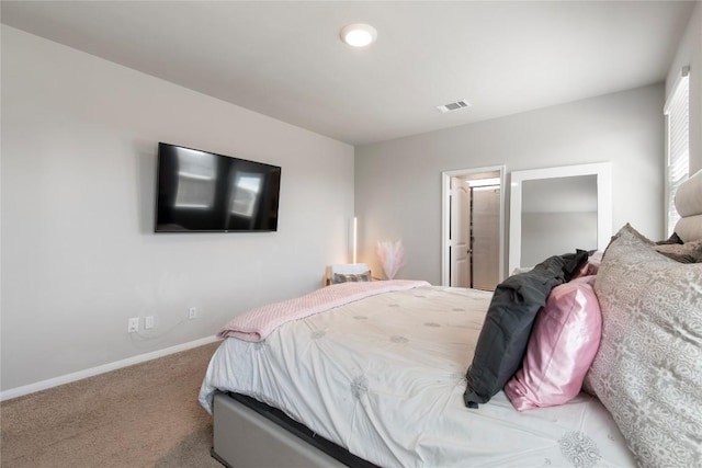 carpeted bedroom with visible vents and baseboards