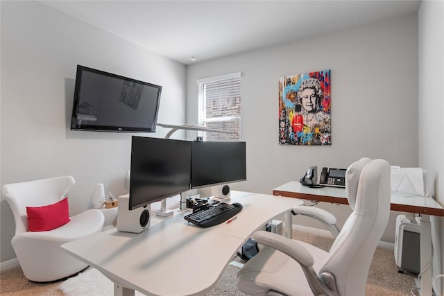 carpeted home office with baseboards